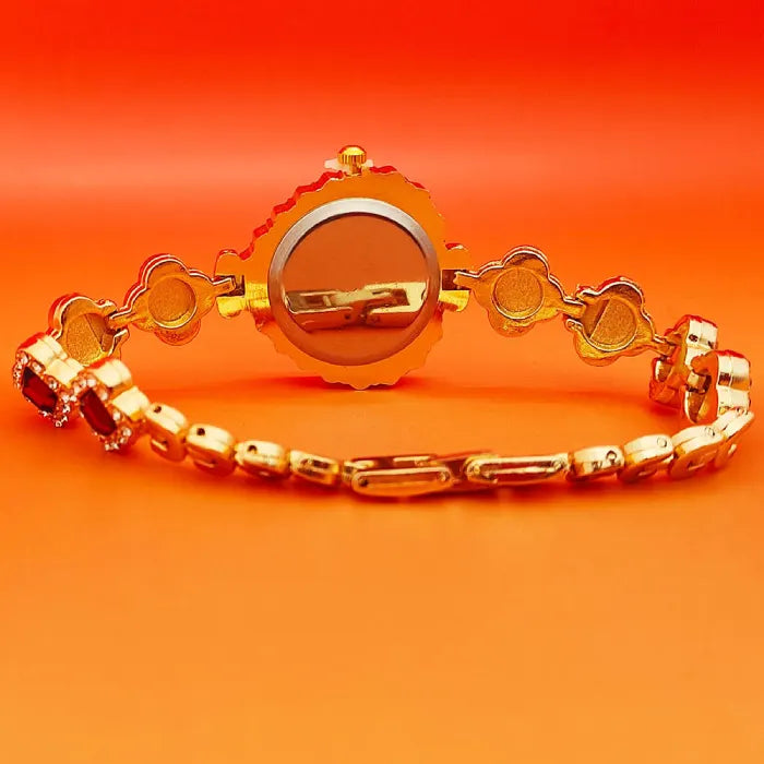 Heart stone watch displayed from rear angle showing gold bracelet links and polished finish providing elegant glamorous accessory detailing