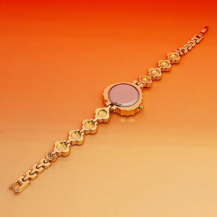 Heart stone watch shown from the back with gold bracelet links offering a detailed view of elegant craftsmanship and stylish wristwear design