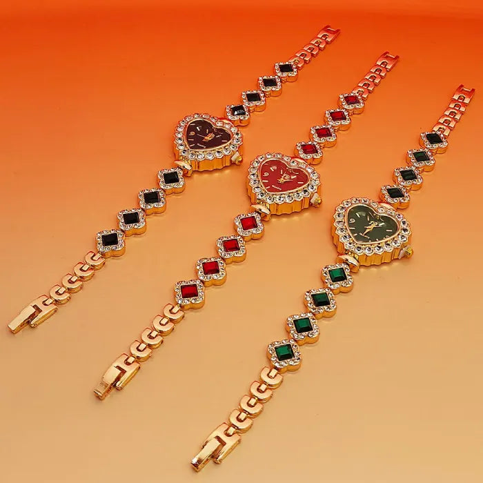 Heart stone watch trio displayed at an angle showing black, red, and green gemstone bracelet designs with sparkling crystal heart dials for women