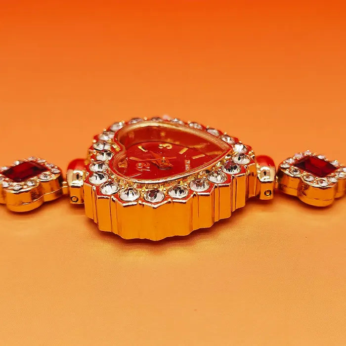 Heart stone watch close-up showing red jeweled heart dial and crystal accents for a glamorous sparkling look ideal for fashionable gifting