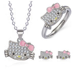 Hello kitty jewelry set with necklace, ring, and earrings featuring pink bows and crystal accents.