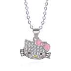 Hello kitty necklace from jewelry set with pink bow and crystal details on silver chain.