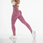 High quality yoga pants in rose pink with contour fit and seamless camo design for gym and studio workouts.