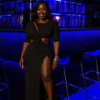 High slit dress in classic black with twisted waist cutout design ideal for nightclub settings with dramatic leg slit