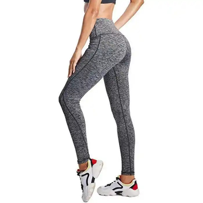  Dark grey high waist leggings with body-hugging fit and athletic seams for active or casual outfits.