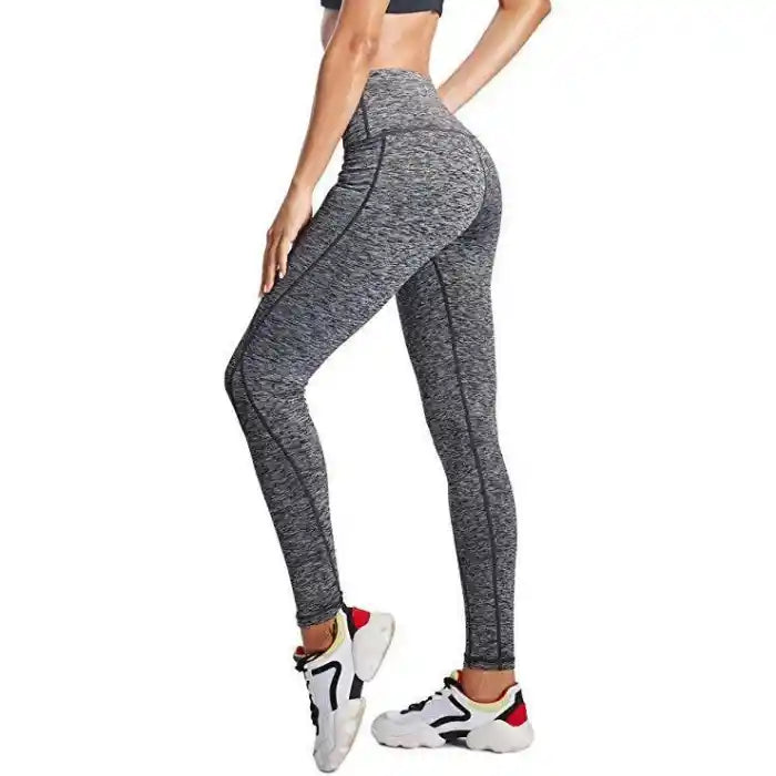  High waist leggings in grey with contour seams and snug fit, ideal for workouts and daily athleisure wear.