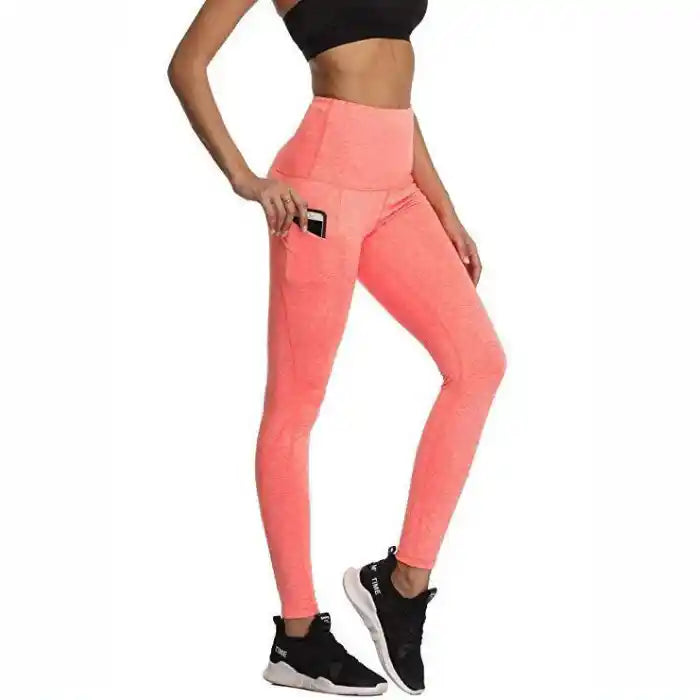 Pink high waist leggings with side phone pocket, perfect for gym sessions and stylish casual looks.