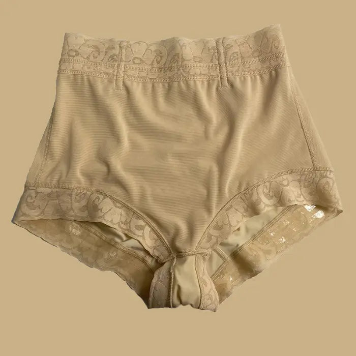 high waisted butt lifting shapewear in beige shown flat with lace detailing and supportive shaping zones for smooth contouring
