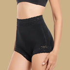 high waisted butt lifting shapewear in black shown from side, highlighting lace waist and sculpting compression for enhanced curves