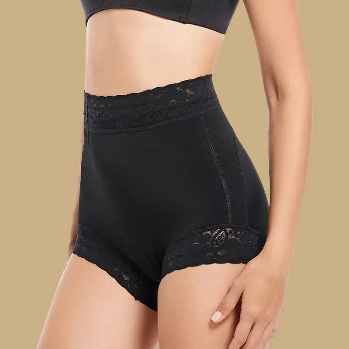 high waisted butt lifting shapewear in black shown from side, highlighting lace waist and sculpting compression for enhanced curves