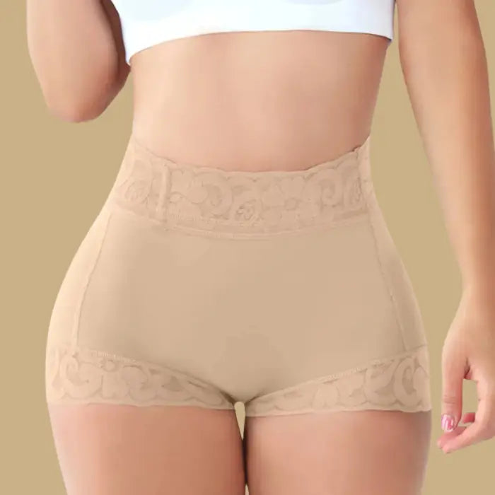 high waisted butt lifting shapewear in seamless beige worn by model, featuring lace trim and shaping compression for a smooth silhouette