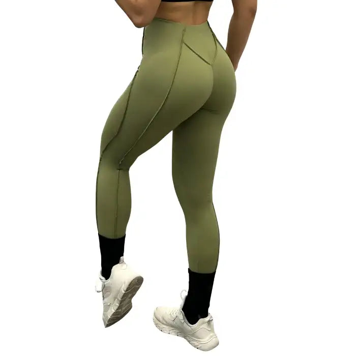 High-waisted leggings in olive green shown from behind, contouring and high-rise design for gym use.