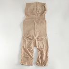 High waisted tummy control shorts in nude shown from the side, showing seamless compression fit