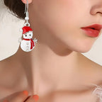 Holiday earrings snowman enamel dangle shown on ear, 38 mm