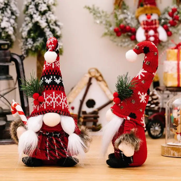 Two charming holiday gnomes with patterned red hats and furry details, surrounded by Christmas decorations and miniature pine trees