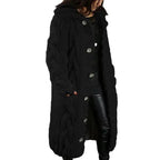 Hooded cable knit cardigan coat long chunky in black with deep textured pattern, decorative buttons.