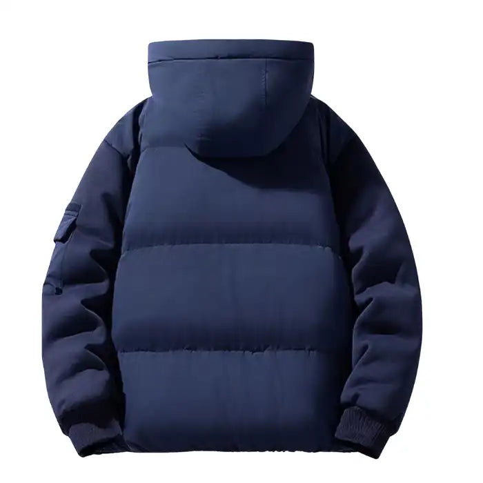Hooded puffer jacket with ribbed cuffs and zipper in navy, displaying the quilted padding and hood from the back view.