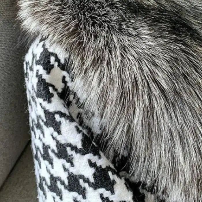  Houndstooth coat with faux fur trim, close-up of plush gray fur texture and classic black white pattern detail.