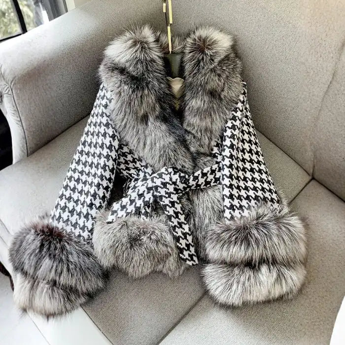 Houndstooth coat with faux fur trim, flat lay view showing gray fur collar, cuffs, and belted waist design.