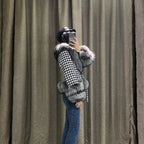  Houndstooth coat with faux fur trim, side profile on model, gray fur cuffs and hem, elegant fitted shape.