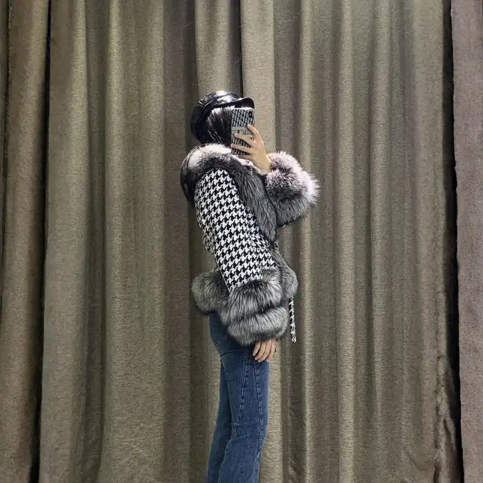  Houndstooth coat with faux fur trim, side profile on model, gray fur cuffs and hem, elegant fitted shape.