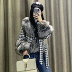 Houndstooth coat with faux fur trim, styled on model with handbag, gray fur accents, fitted silhouette shown.