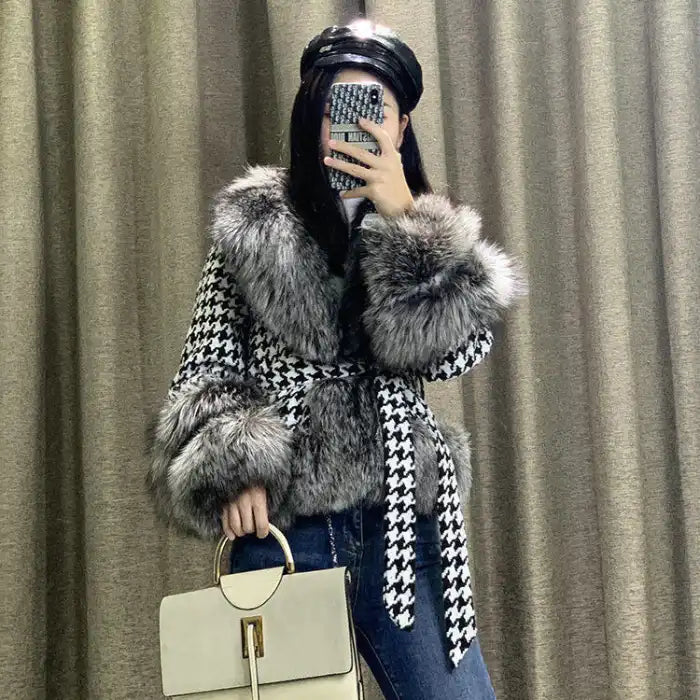 Houndstooth coat with faux fur trim, styled on model with handbag, gray fur accents, fitted silhouette shown.