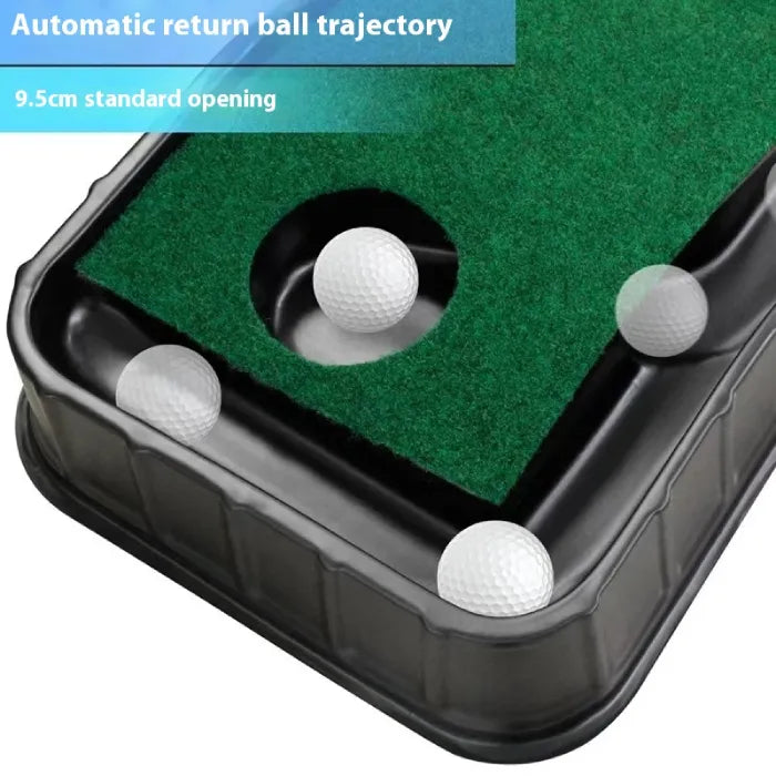 Indoor putting green close-up of ball return hole with multiple white golf balls around target