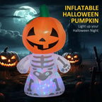 Light-up inflatable Halloween yard decoration with pumpkin head and skeleton body at night