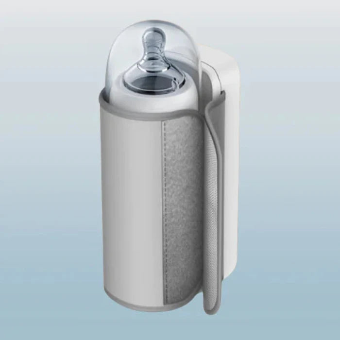 Cylindrical insulated bottle warmer with clear dome lid, showing internal bottle nipple, white exterior with textured grip