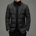 Insulated jacket with blazer design in black shown from the front with hands in pockets.