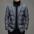 Insulated jacket in tailored grey with blazer-style cut and a modern winterwear look.