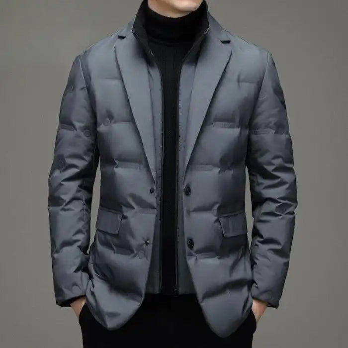 Insulated jacket in tailored grey with blazer-style cut and a modern winterwear look.