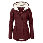 Insulated parka in maroon for women featuring soft fur hood lining and front pocket design
