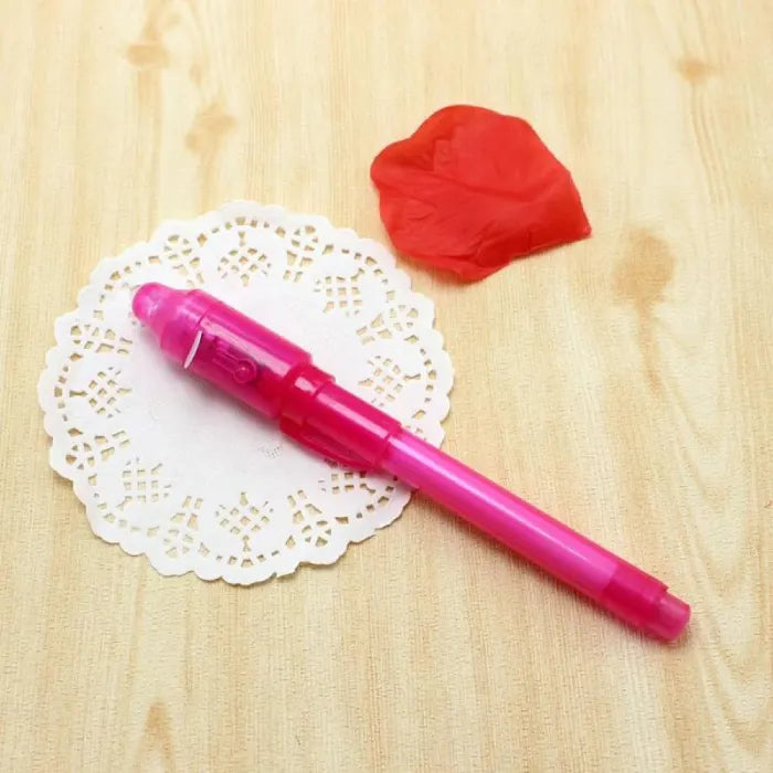 invisible ink pen with uv light shown on a doily with pink casing