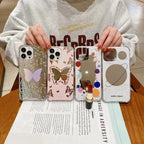 iPhone 15 case collection showing side-by-side comparison of butterfly-themed designs in pink and black alongside space-themed patterns