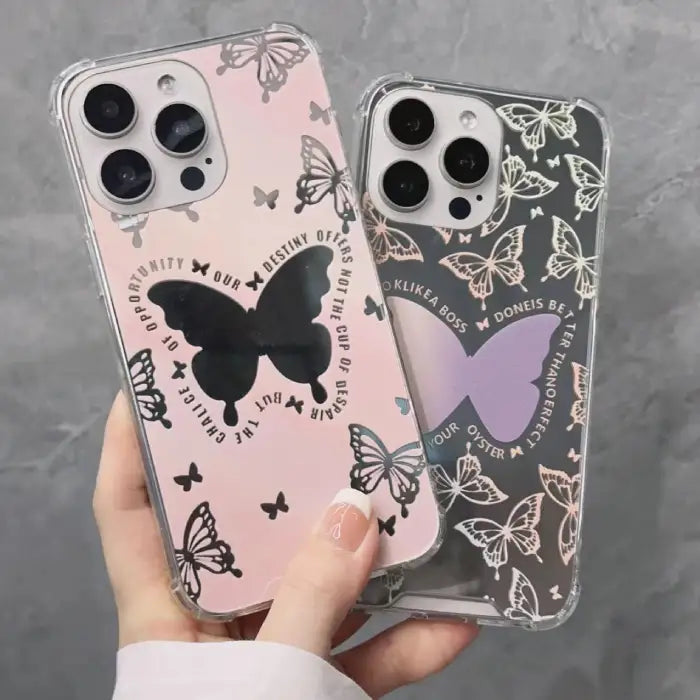 iPhone 15 case featuring pink background with decorative black butterflies and inspirational quote in circular pattern around central butterfly