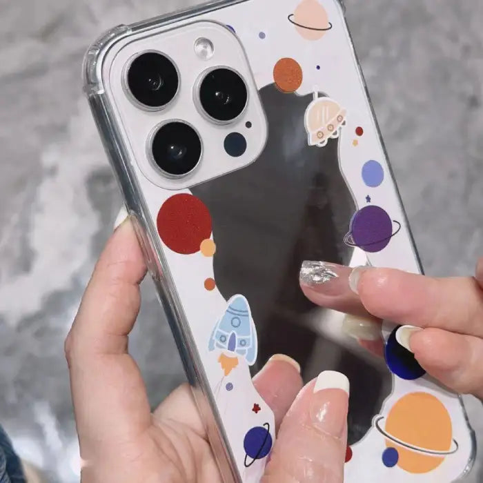iPhone 15 case collection featuring four stylish designs including butterfly patterns, space themes and minimalist options for protection