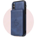 iPhone leather phone case in navy blue featuring card storage pocket and embossed wireless charging symbol on premium material