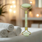 Glowing jade roller on a bed with white towels and blurred lights in the background
