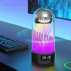 Colorful jellyfish-shaped LED lamp on desk next to keyboard, emitting vibrant light streams beneath glass dome with digital clock base