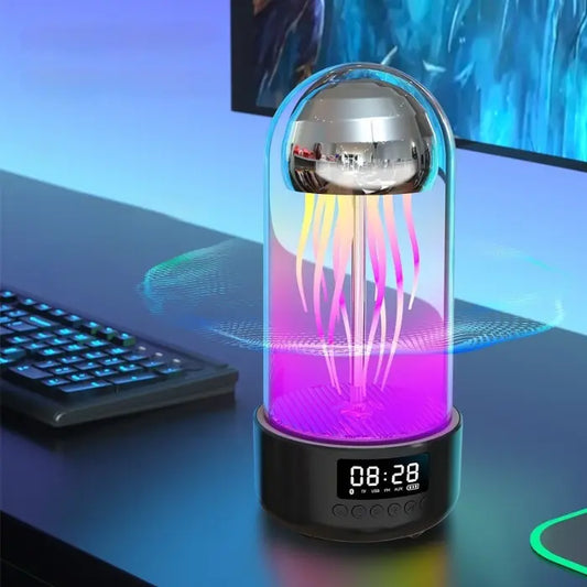 Colorful jellyfish-shaped LED lamp on desk next to keyboard, emitting vibrant light streams beneath glass dome with digital clock base