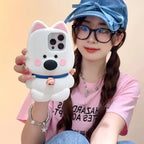 kawaii dog phone case with a 3D white dog design, held by a smiling person in a pink shirt.