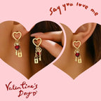 key and locket earrings with gold heart frame red gem heart charm and dangling key and lock shown on ears