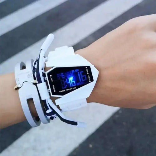  Kids watch with white strap and blue LED digital display on wrist, water-resistant 50M.