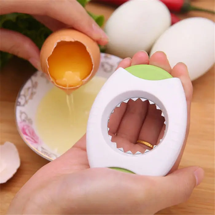 kitchen egg opener cracking a brown egg over a bowl with yolk and egg whites visible
