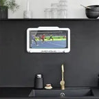 Waterproof tablet mounted above kitchen sink displays sports event, enhancing multitasking capabilities in modern kitchen design.
