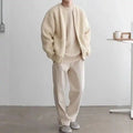 Knit Cardigan in beige paired with matching pants and top, styled in a clean monochrome neutral look.