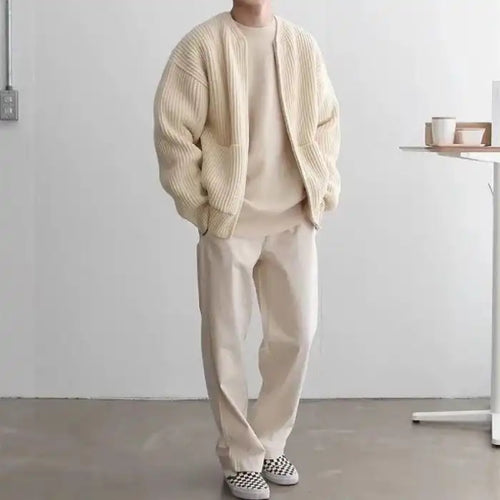 Knit Cardigan in beige paired with matching pants and top, styled in a clean monochrome neutral look.