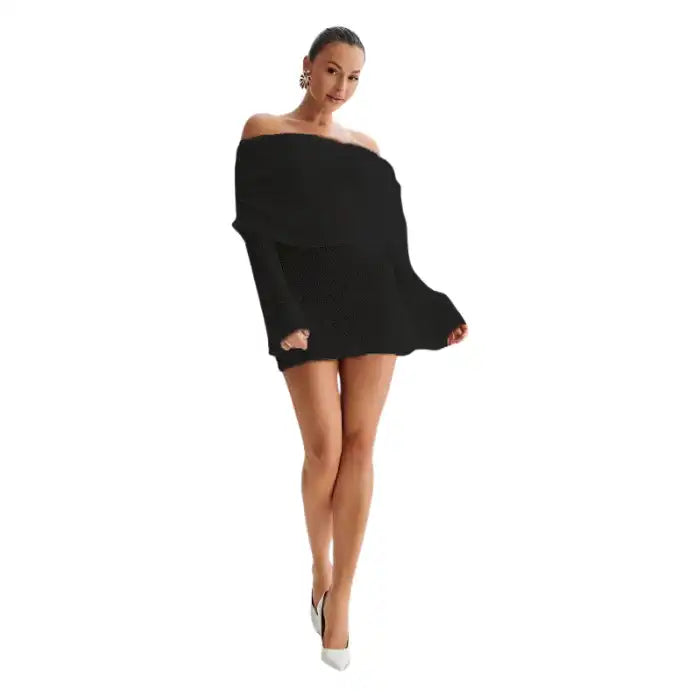 Knitted mini dress in black with long sleeves, off-shoulder neckline, and white heels.